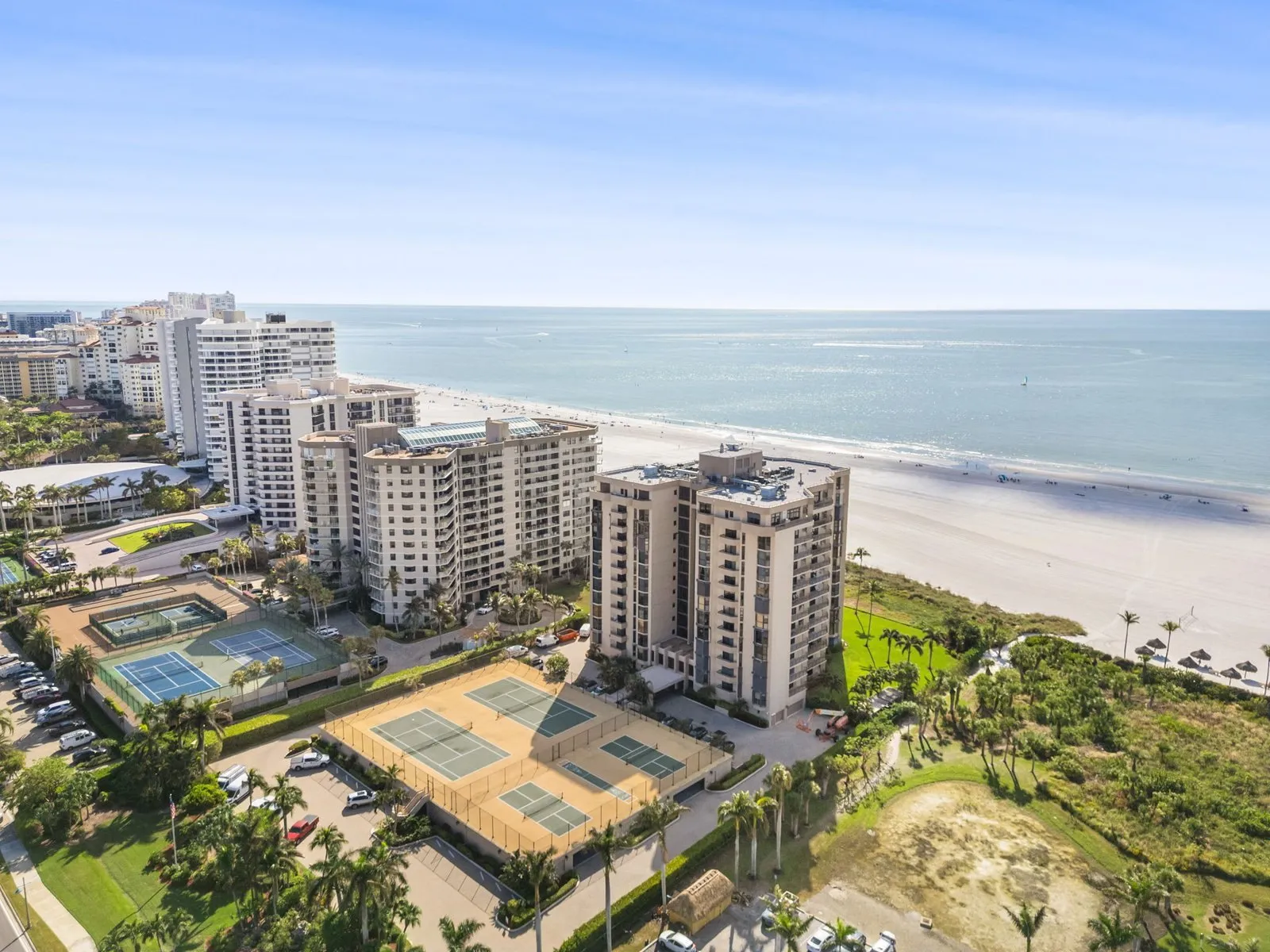 Aerial photo of Gulf beach condominiums and white sand