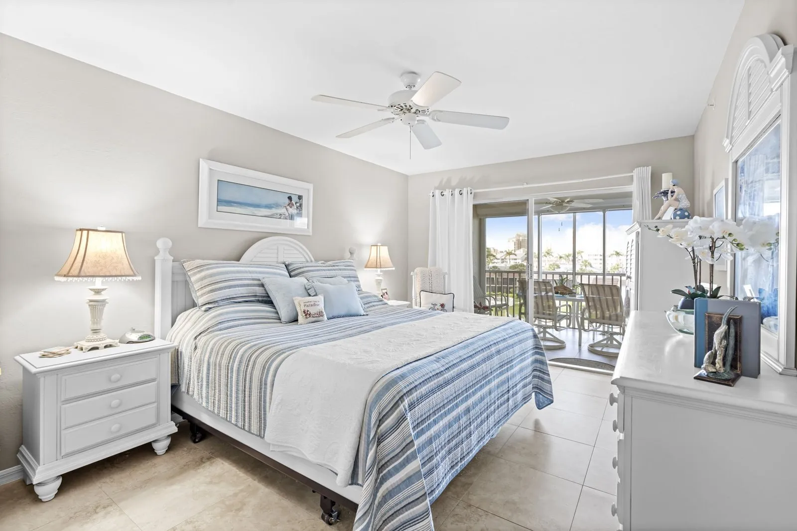 Coastal bedroom with a striped bedspread