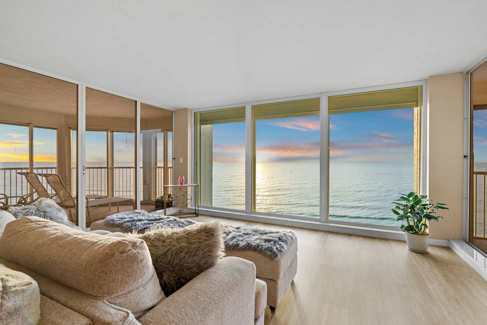 Condo living room overlooking the Gulf at sunset