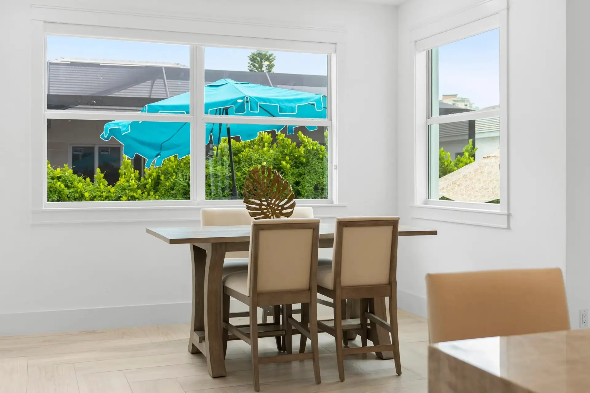 Dining nook with windows onto the pool