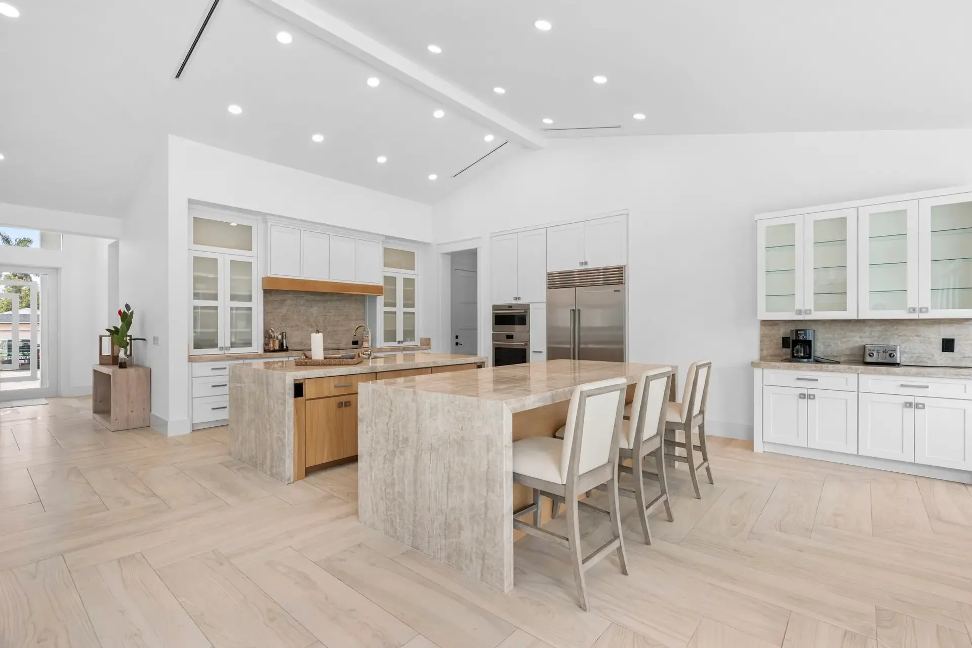 Open-plan kitchen and dining area with pendant lights