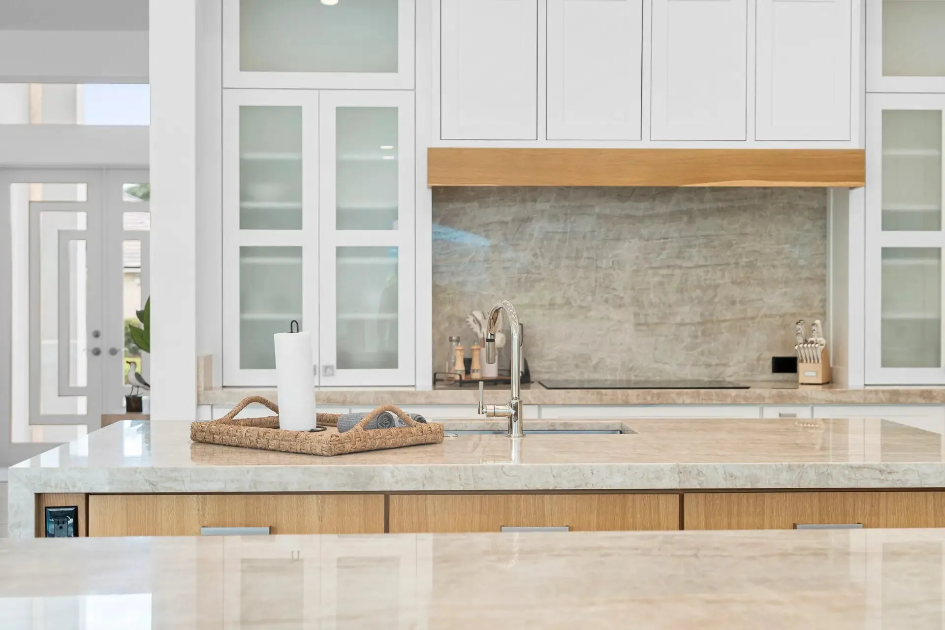 Kitchen with a tiled range wall and floating shelves