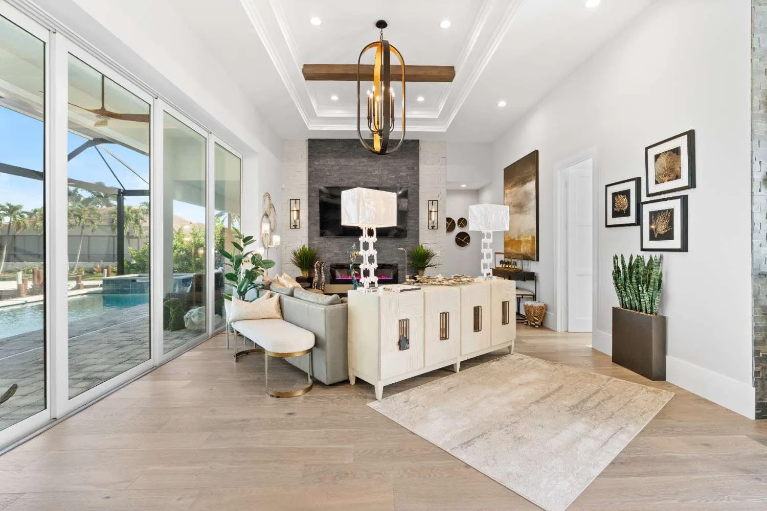 Bright living and dining area looking out to the pool