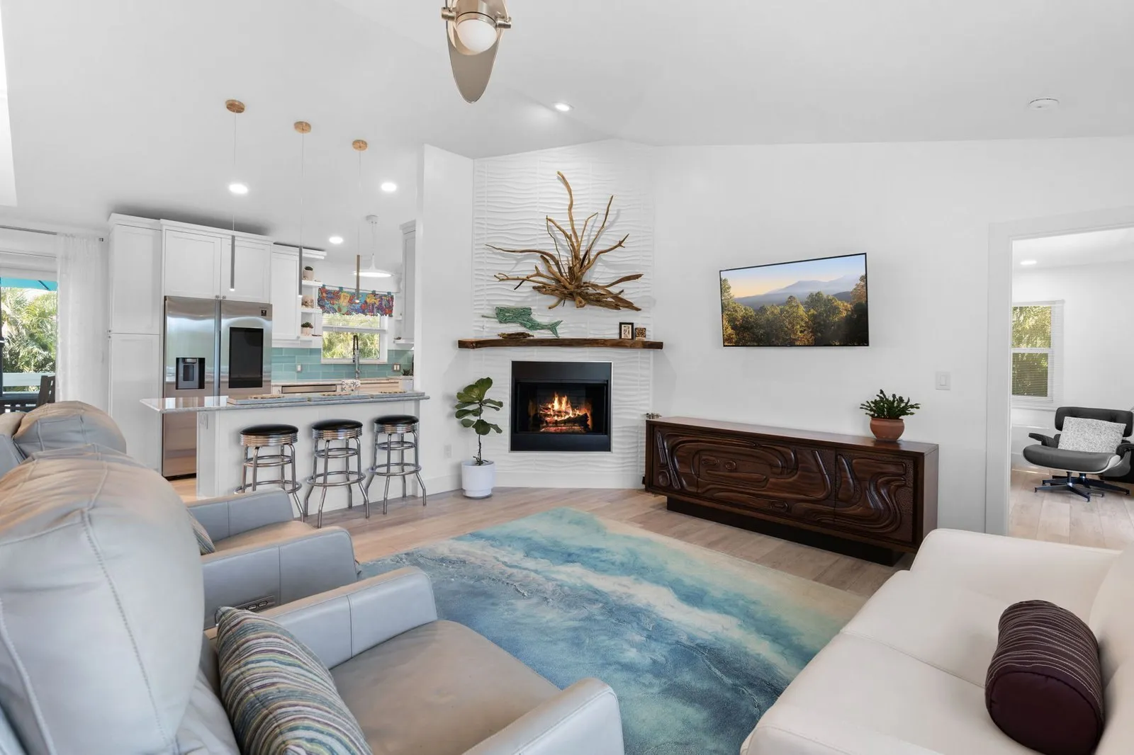 Living room with a fireplace and wet bar