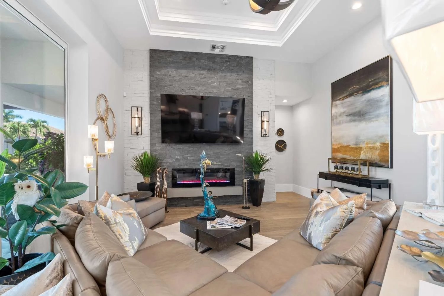 Living room with a stone media wall and sectional sofa