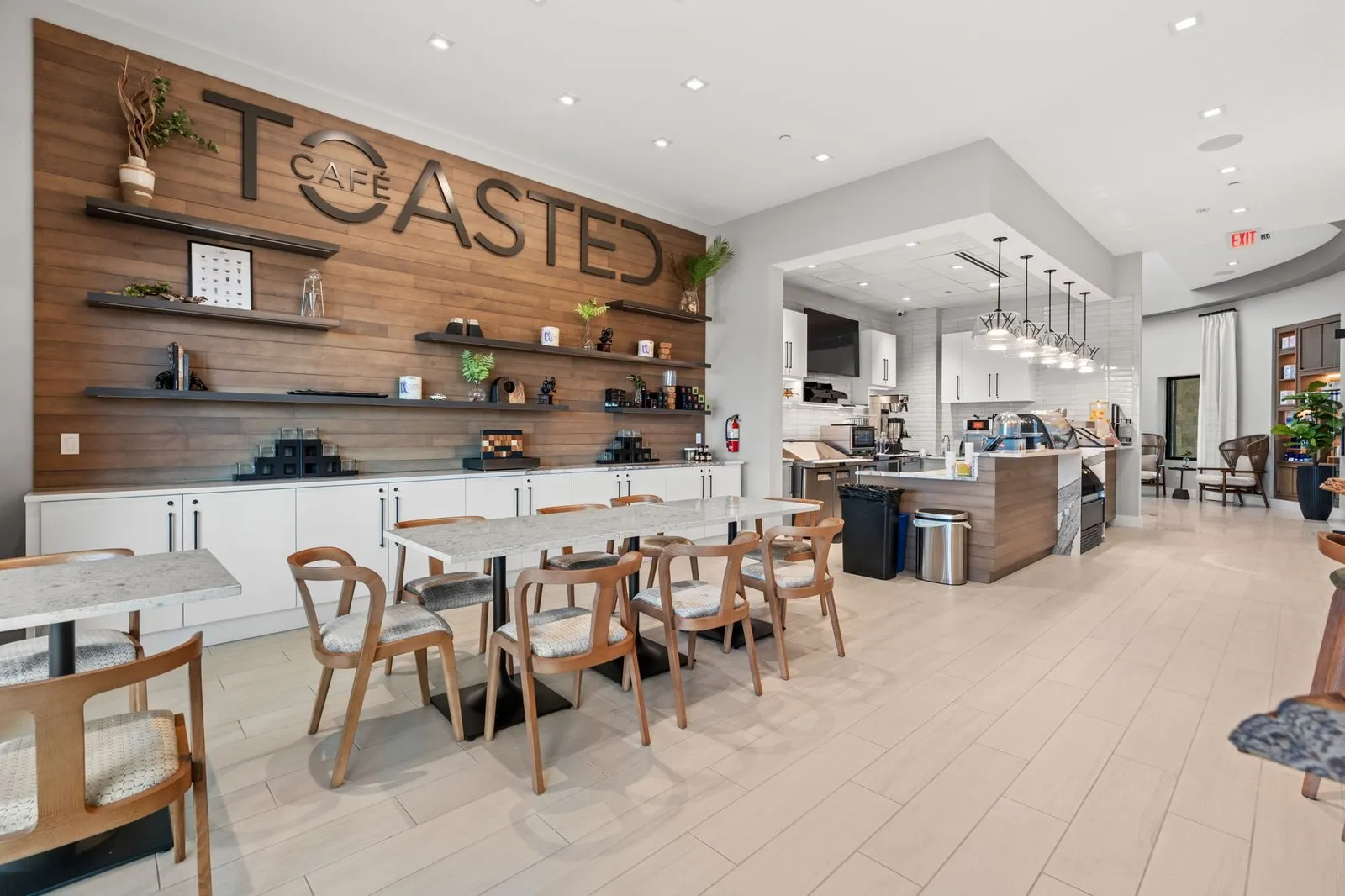 Open kitchen and dining room with a wood accent wall