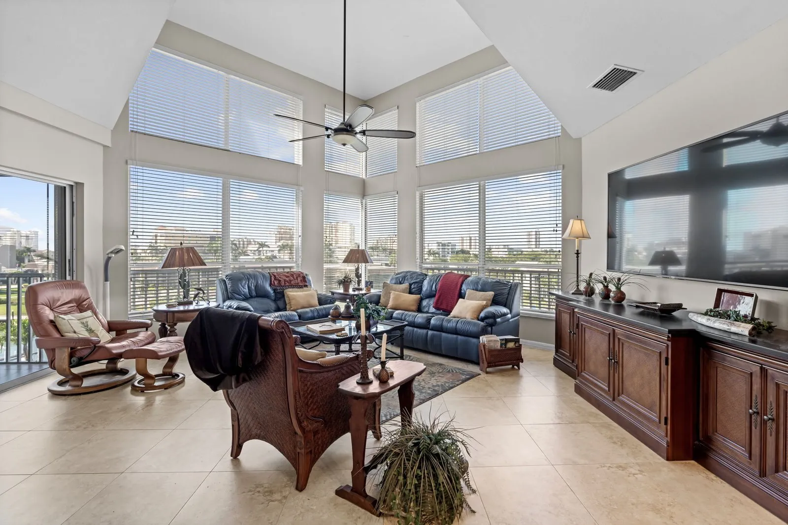Open living room with high ceilings and tall windows