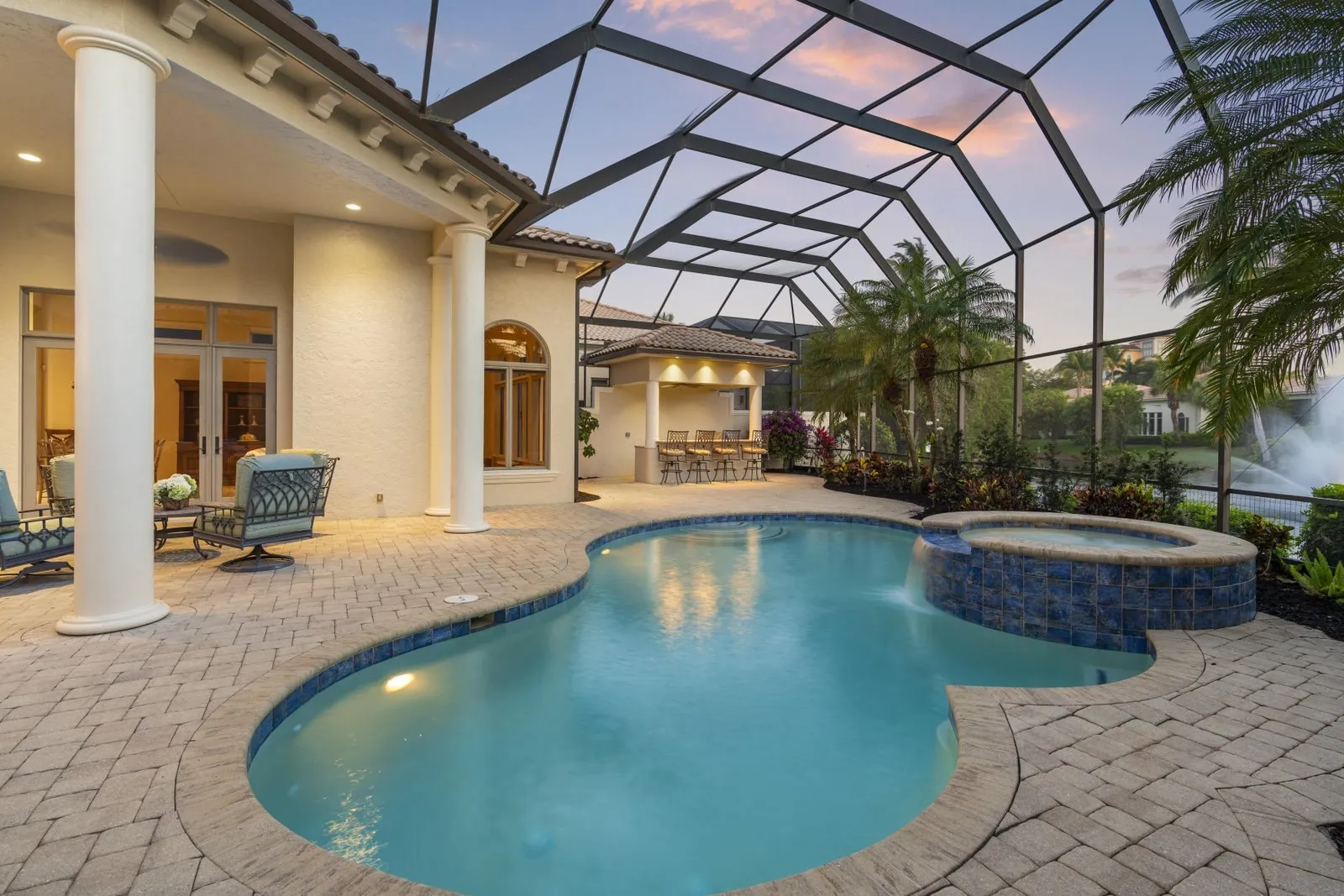 Pool and lanai framed by white columns